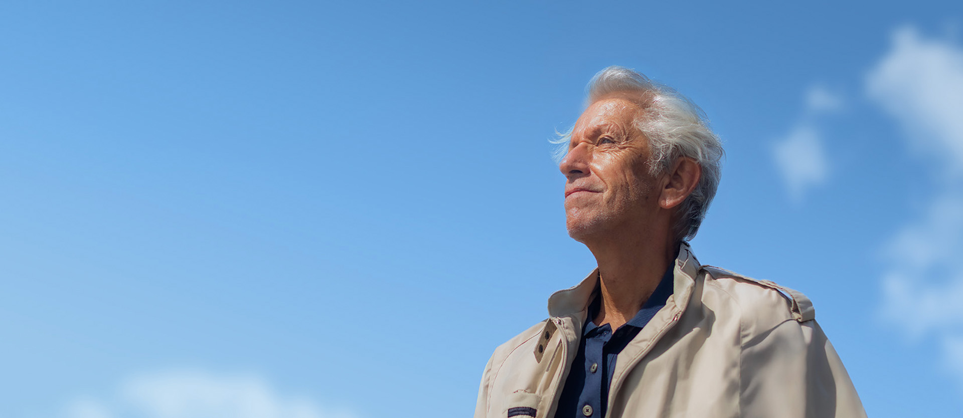 Jim standing against blue sky