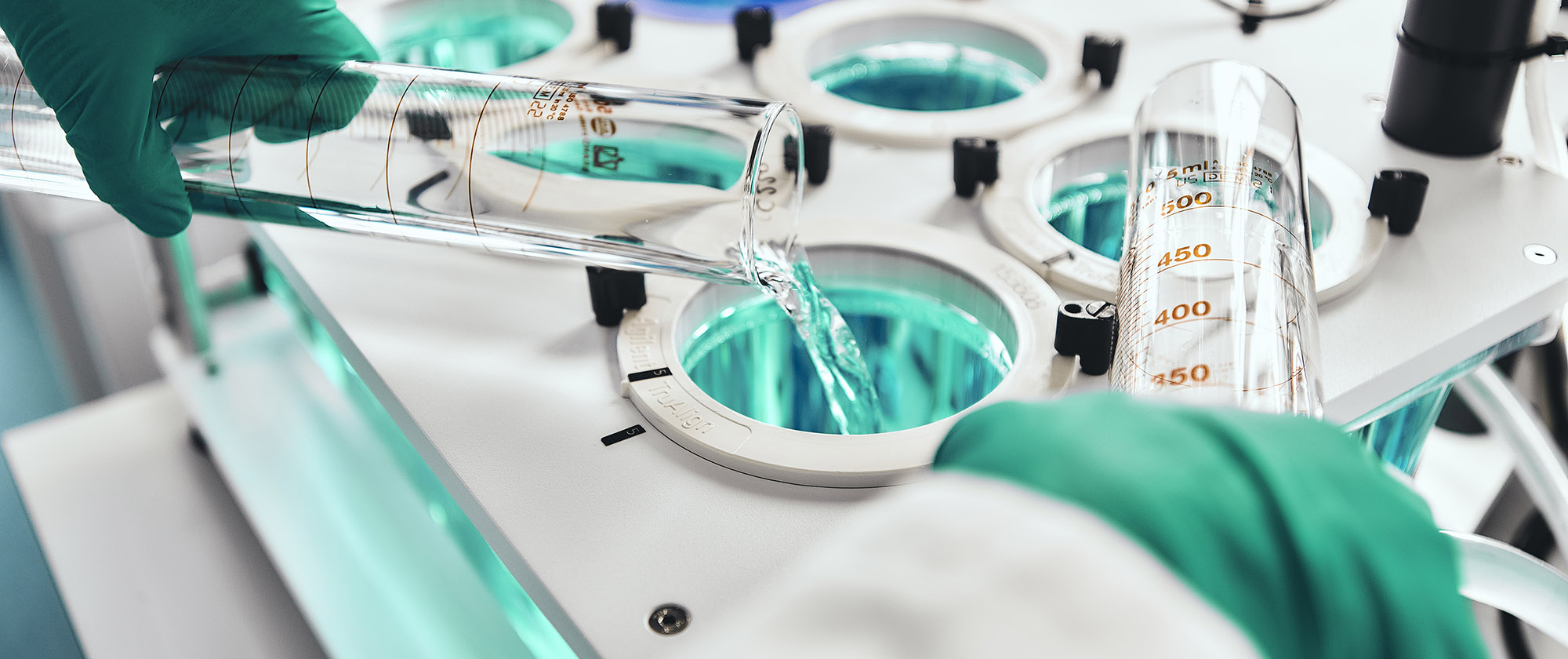 A scientist prepares a dissolution apparatus for the testing of medicines